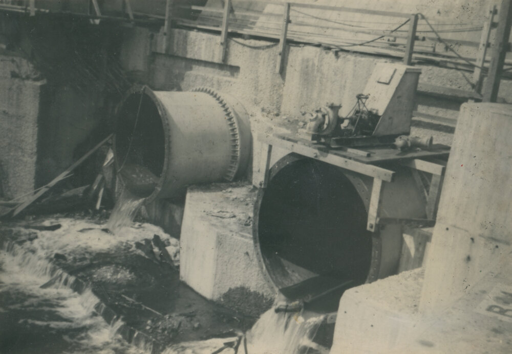 Somerset Dam wall showing protruding pipes and valves. Early construction photos, 1935-1943. 