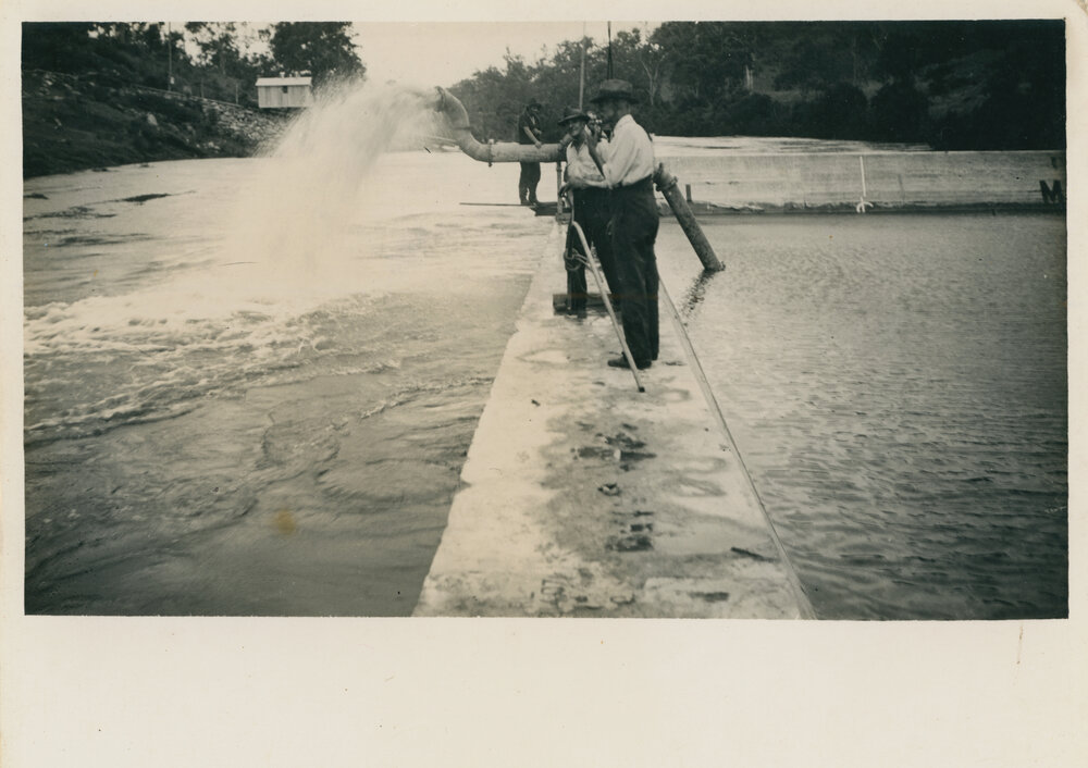 Water being pumped from work site after flood waters receded