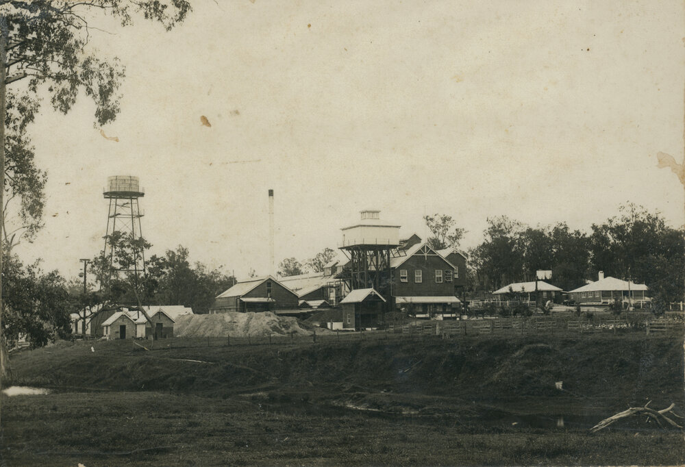 Toogoolawah condensed milk factory tower, steel chimney and factory houses