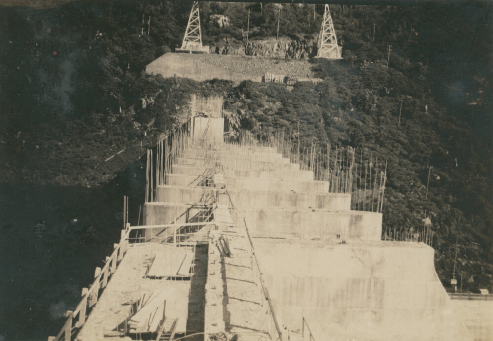 A view across the top Somerset Dam wall under construction