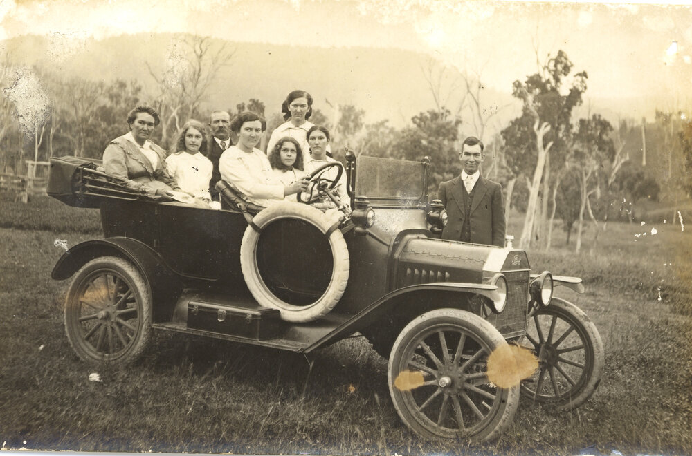 Kirby family in the car with Grandma and Granddad Kirby seated in the back