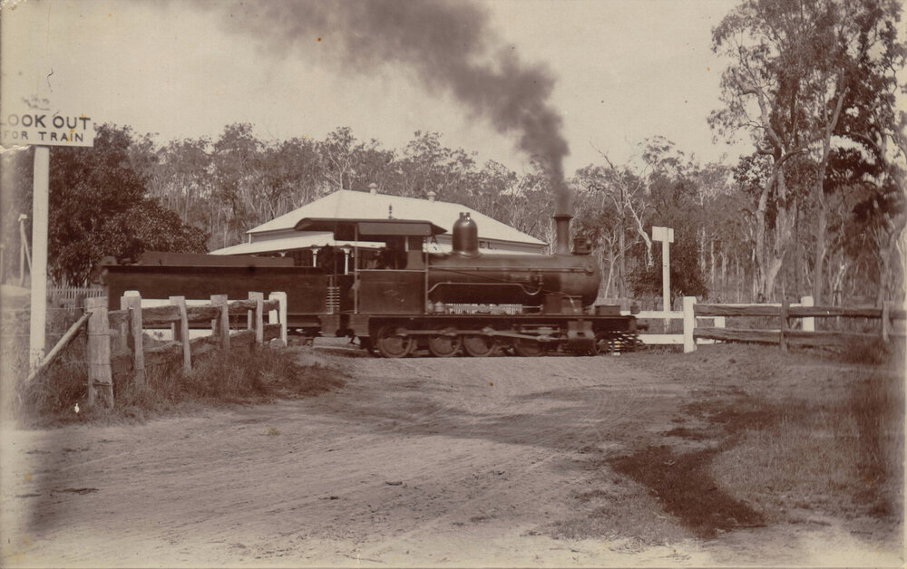 A railroad train passing in front  of the Ottaba Hotel