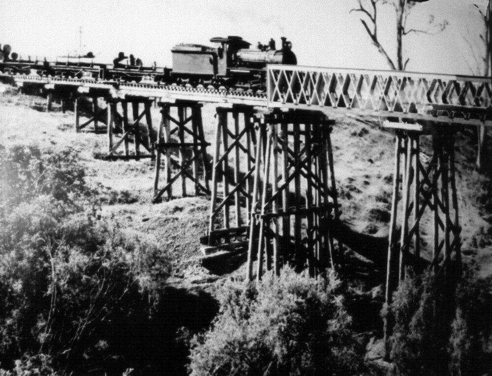 Steam train crossing the rail bridge over Lockyer Creek