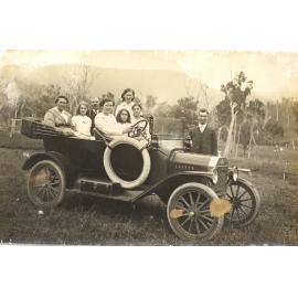 Kirby family in the car with Grandma and Granddad Kirby seated in the back