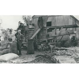 A corn sheller on a farm in Lowood