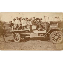 A group of people aboard a truck for a group outing