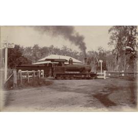 A railroad train passing in front  of the Ottaba Hotel