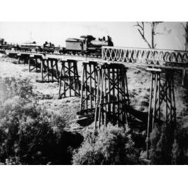 Steam train crossing the rail bridge over Lockyer Creek