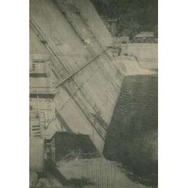 Somerset Dam wall as water gushes from pipes