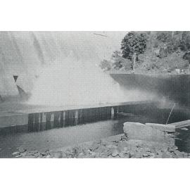 Valves at work as water gushes out of the pipes in the Somerset Dam wall