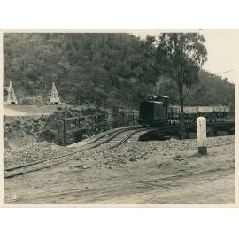 A locomotive hauling rocks 