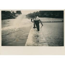 Water being pumped from work site after flood waters receded